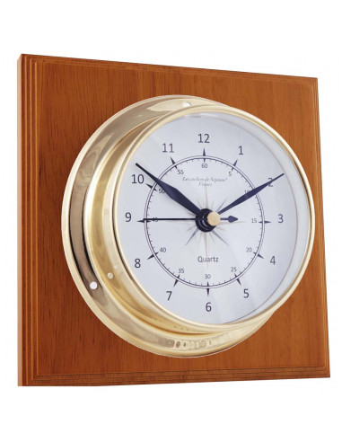 BRASS CLOCK ON WOODEN BOARD